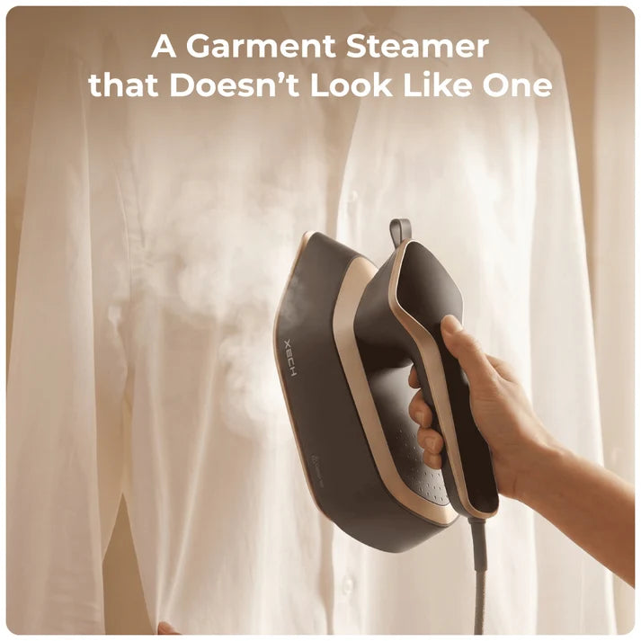 XECH Imperia Garment Steamer in use on a white shirt, showcasing its stylish design and effective steaming.